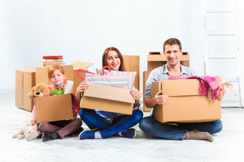 Loading furniture into a moving truck on a North London street
