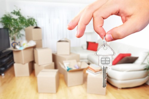Removal team loading household items into a moving van