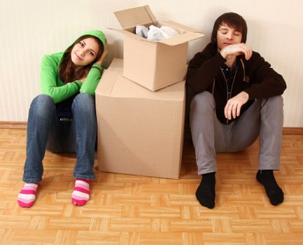 Furniture being carried through a London residential property