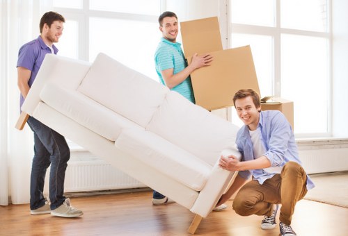 Professional movers handling office furniture in North London